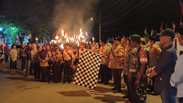 Disdikbud Bolsel Dorong Semangat Patriotisme Siswa Lewat Pawai Taptu